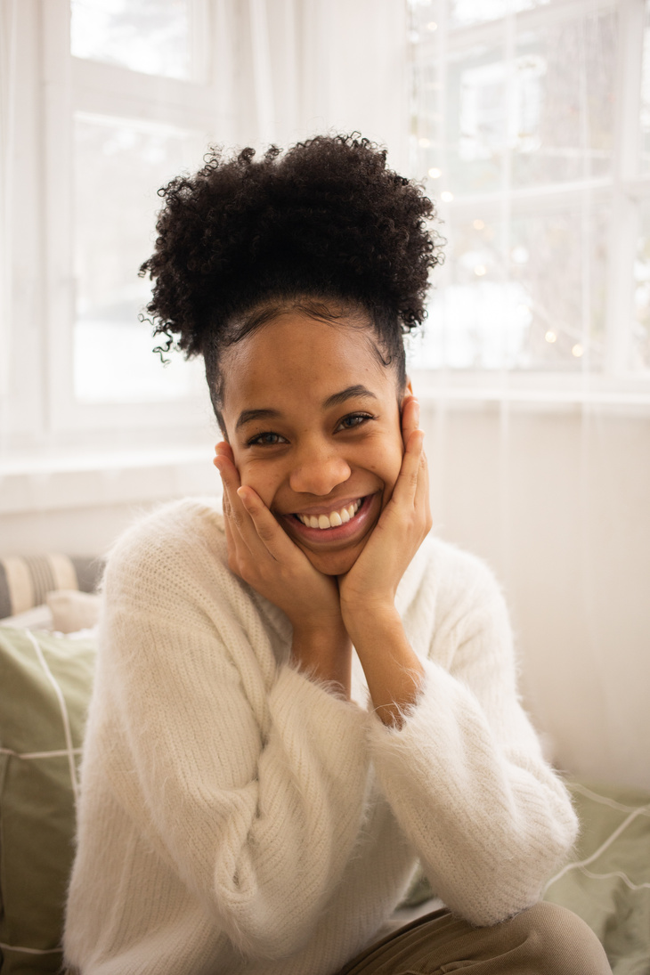 A Happy Woman holding Her Face